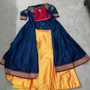 Indian outfit with blouse skirt and jacket on top